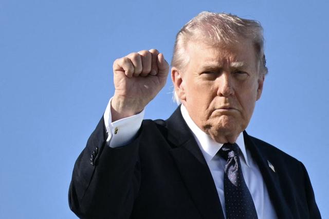 US President Donald Trump gestures as he boards Air Force One before departing Palm Beach International Airport in West Palm Beach, Florida, on March 1, 2026, on his way back to Washington, DC. The United States and Israel launched massive bombardments against Iran and killed its supreme leader on February 28, with attacks ongoing Sunday. The US military on Sunday said three service members have been killed and five seriously wounded in the war against Iran -- the first casualties announced on the US side. (Photo by Mandel NGAN / AFP)