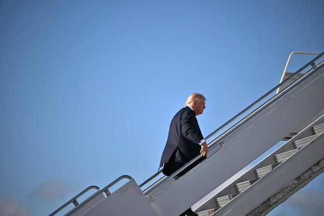 US President Donald Trump boards Air Force One before departing Palm Beach International Airport in West Palm Beach, Florida, on March 1, 2026, on his way back to Washington, DC. The United States and Israel launched massive bombardments against Iran and killed its supreme leader on February 28, with attacks ongoing Sunday. The US military on Sunday said three service members have been killed and five seriously wounded in the war against Iran -- the first casualties announced on the US side. (Photo by Mandel NGAN / AFP)