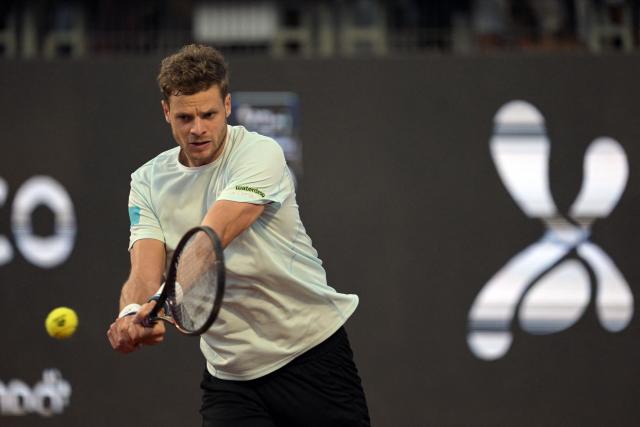 Germany's Yannick Hanfmann returns the ball to Italy's Luciano Darderi during the ATP Santiago Open men's singles tennis final match at the Club San Carlos de Apoquindo in Santiago on March 1, 2026. (Photo by Rodrigo ARANGUA / AFP)