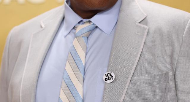 US actor Omar Miller wears an ICE OUT pin as he attends the 32nd Annual Actor Awards at the Shrine Auditorium in Los Angeles on March 1, 2026. (Photo by Michael Tran / AFP)