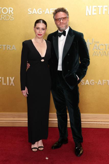 US actress, writer, and producer Lauren Miller and Canadian producer Seth Rogen attends the 32nd Annual Actor Awards at the Shrine Auditorium in Los Angeles on March 1, 2026. (Photo by Patrick T. Fallon / AFP)