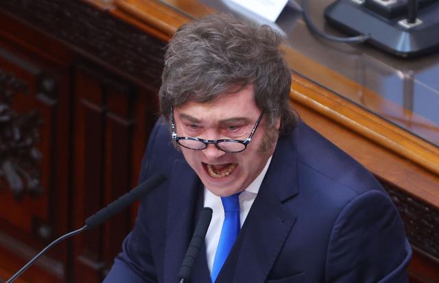 Argentina's President Javier Milei speaks during his annual speech to parliament ahead of the inauguration of the 144th ordinary session of Congress in Buenos Aires on March 1, 2026. (Photo by ALEJANDRO PAGNI / AFP)