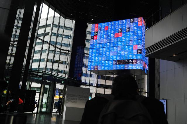 An electronic quotation board displays the Nikkei 225 stock prices on the Tokyo Stock Exchange in Tokyo on March 2, 2026. Asian stocks dropped in early trade March 2 on the back of fears for the global economy following US-Israeli attacks on Iran over the weekend. (Photo by Kazuhiro NOGI / AFP)