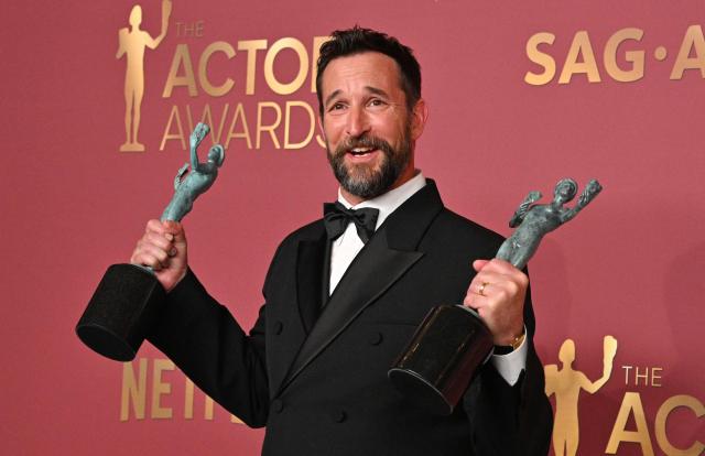 US actor Noah Wyle poses with the awards for Outstanding Performance by a Male Actor in a Drama Series and Outstanding Performance by an Ensemble in a Drama Series for "The Pitt" during the 32nd Annual Actor Awards at the Shrine Auditorium in Los Angeles on March 1, 2026. (Photo by Frederic J. Brown / AFP)