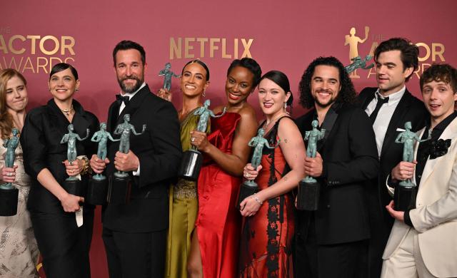 US actor Noah Wyle (3L) holds the award for Outstanding Performance by a Male Actor in a Drama Series with the rest ot the cast winners of Outstanding Performance by an Ensemble in a Drama Series "The Pitt" during the 32nd Annual Actor Awards at the Shrine Auditorium in Los Angeles on March 1, 2026. (Photo by Frederic J. Brown / AFP)