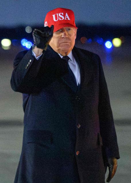 US President Donald Trump gestures after stepping off Air Force One upon arrival at Joint Base Andrews on March 1, 2026, on his way back to Washington, DC after spending the weekend at his Mar-a-Lago resort. The United States and Israel launched massive bombardments against Iran and killed its supreme leader on February 28, with attacks ongoing Sunday. The US military on Sunday said three service members have been killed and five seriously wounded in the war against Iran -- the first casualties announced on the US side. (Photo by Mandel NGAN / AFP)