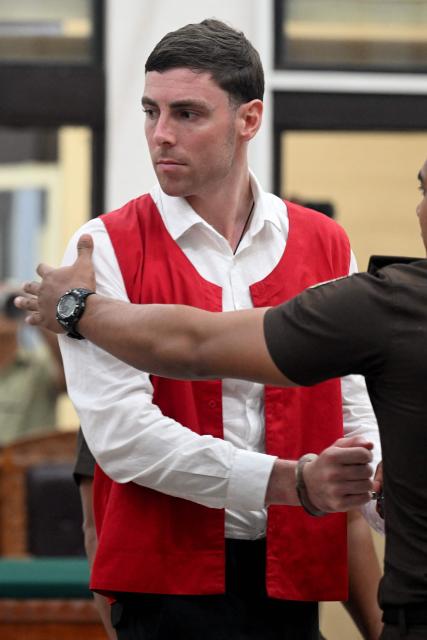 Australian suspect Darcy Francesco Jenson attends his trial at a courtroom in Denpasar, Indonesia's Bali island, on March 2, 2026. The trial of three Australians accused of plotting the murder of a compatriot at a villa in Bali continues, with all facing the death penalty. (Photo by SONNY TUMBELAKA / AFP)