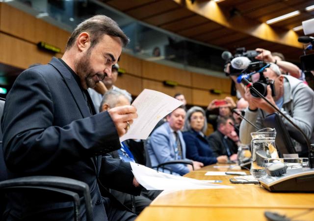Iran’s ambassador to the International Atomic Energy Agency (IAEA) Reza Najafi attends the special meeting on Iran, initiated by Russia, prior to the IAEA’s Board of Governors meeting at the agency's headquarters in Vienna, Austria on March 2, 2026. Delegates at the United Nations' nuclear agency began meeting on Monday for an extraordinary session on Iran in the wake of the US-Israeli strikes on the Islamic republic. Russia, a key ally of Tehran, requested the meeting at the Vienna-based International Atomic Energy Agency (IAEA), following the same request by Iran. The extraordinary meeting precedes an already scheduled regular session of the IAEA's board of governors, which represents 35 countries. (Photo by Joe Klamar / AFP)