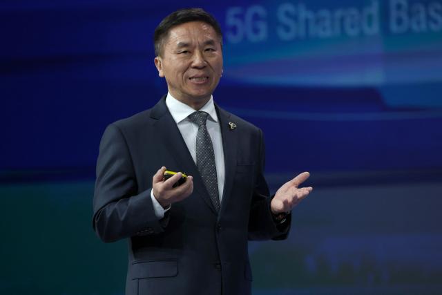 China Telecom President Liu Guiqing speaks on stage during the Mobile World Congress (MWC), the world's biggest mobile technology showcase and fair, on March 2, 2026 in Barcelona. The Mobile World Congress (MWC), the major annual telecommunications event, opens today in Barcelona for an edition where Artificial Intelligence in telecommunications will take center stage in the debates. The event, which marking its twentieth anniversary, will host the world's leading telecommunications operators and numerous manufacturers. 109,000 industry professionals and visitors are expected. (Photo by Lluis GENE / AFP)