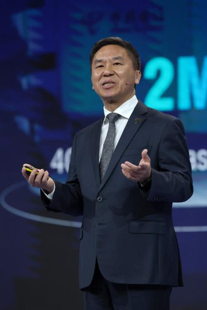 China Telecom President Liu Guiqing speaks on stage during the Mobile World Congress (MWC), the world's biggest mobile technology showcase and fair, on March 2, 2026 in Barcelona. The Mobile World Congress (MWC), the major annual telecommunications event, opens today in Barcelona for an edition where Artificial Intelligence in telecommunications will take center stage in the debates. The event, which marking its twentieth anniversary, will host the world's leading telecommunications operators and numerous manufacturers. 109,000 industry professionals and visitors are expected. (Photo by Lluis GENE / AFP)