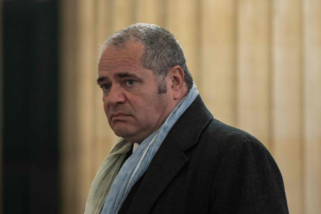 François Thierry, former chief of the French anti-narcotics office (Ocrtis), waits to enter the courtroom for the opening of his trial on charges of complicity in drug trafficking alongside 17 co-defendants, at the courthouse in Bordeaux, south-western France, on March 2, 2026. (Photo by Philippe LOPEZ / AFP)