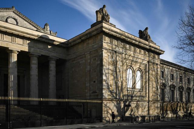A pedestrian walks past the courthouse in Bordeaux, south-western France, on March 2, 2026. (Photo by Philippe LOPEZ / AFP)