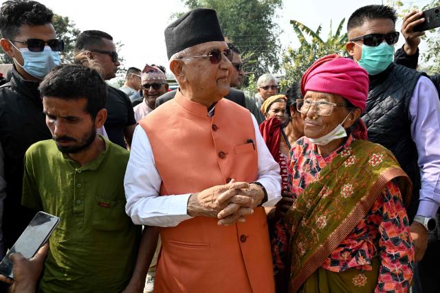 Khadga Prasad Sharma Oli (C), Nepal's former prime minister and Communist Party of Nepal-Unified Marxist Leninist (CPN-UML) leader, take part in a rally on the final day of campaigning ahead of the country's general election at Gauradaha in Jhapa district on March 2, 2026. (Photo by Prakash MATHEMA / AFP)