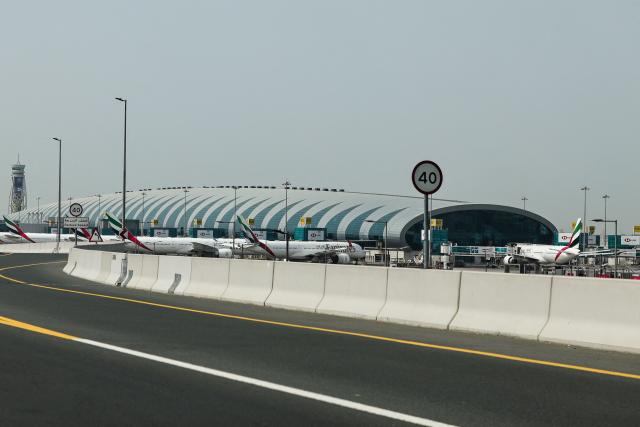 Emirates airline planes are parked on the tarmac at Dubai International Airport in Dubai on March 2, 2026. Israel bombarded Lebanon on March 2 following rocket fire from Hezbollah, several American warplanes crashed in Kuwait and Iran lashed out against the region with missiles, as the war with Israel and the United States expanded. (Photo by Fadel SENNA / AFP)