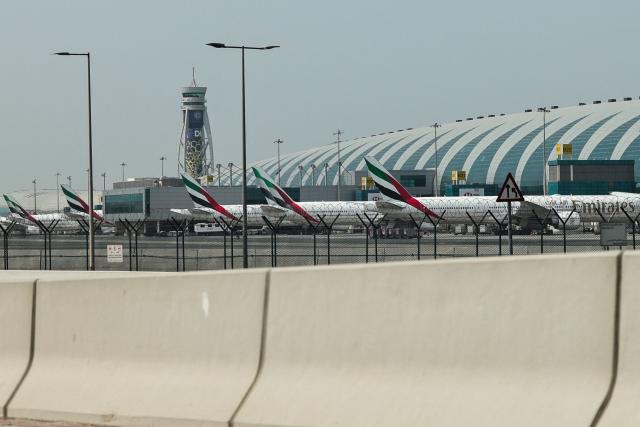 Emirates airline planes are parked on the tarmac at Dubai International Airport in Dubai on March 2, 2026. Israel bombarded Lebanon on March 2 following rocket fire from Hezbollah, several American warplanes crashed in Kuwait and Iran lashed out against the region with missiles, as the war with Israel and the United States expanded. (Photo by Fadel SENNA / AFP)