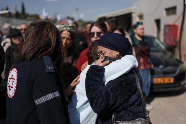 Mourners grieve during the funeral of Sarah and Ronit Elimelech, a day after a missile attack on Bet Shemesh killed several people some 30 kilometres west of Jerusalem on March 2, 2026. A barrage of missiles launched from Iran killed at least six people in the central Israel city of Bet Shemesh on March 1, Israel's first responders agency, Magen David Adom (MDA) said, the day after the US and Israel attacked Iran and assassinated its supreme leader. (Photo by Ilia YEFIMOVICH / AFP)