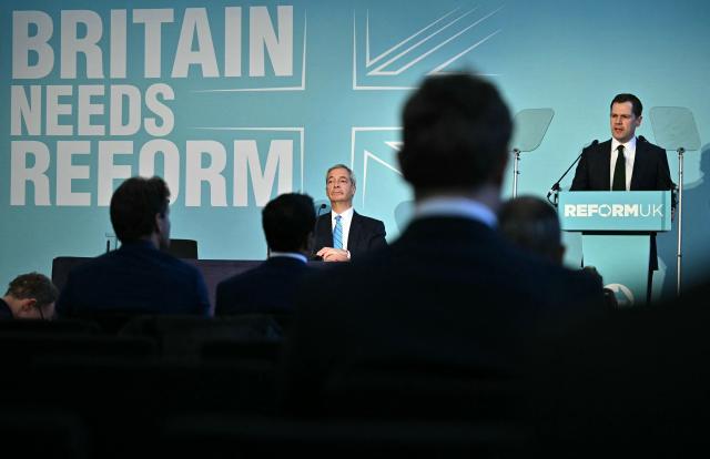 Reform UK leader Nigel Farage (L) listens as Reform's Treasury spokesperson, Robert Jenrick speaks during a party press conference in central London on March 2, 2026. (Photo by Ben STANSALL / AFP)