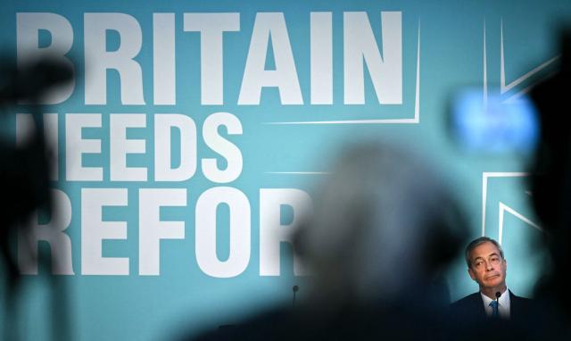 Reform UK leader Nigel Farage listens as Reform's Treasury spokesperson Robert Jenrick (unseen) speaks during a party press conference in central London on March 2, 2026. (Photo by Ben STANSALL / AFP)