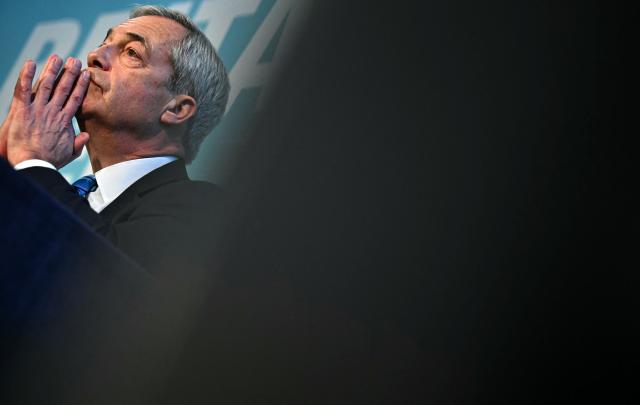 Reform UK leader Nigel Farage listens as Reform's Treasury spokesperson Robert Jenrick (unseen) speaks during a party press conference in central London on March 2, 2026. (Photo by Ben STANSALL / AFP)