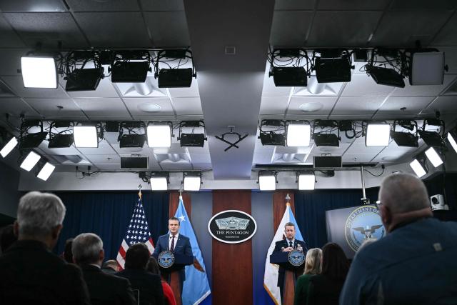 (L/R) US Defense Secretary Pete Hegseth and the Chairman of the Joint Chiefs of Staff General Dan Caine speak during a press conference on US military action in Iran, at the Pentagon in Washington, DC, on March 2, 2026. The United States hit hundreds of targets across Iran, and Israel expanded its bombing to Lebanon on Monday as President Donald Trump vowed to avenge the first US deaths in the war he launched to topple Tehran's ruling clerics. Iranian forces fired missiles and drones across the Middle East, killing people in Israel and the United Arab Emirates, in retaliation for the conflict that began February 28 with the death of Iran's supreme leader, Ayatollah Ali Khamenei. (Photo by Brendan SMIALOWSKI / AFP)