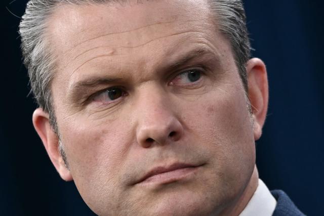 US Defense Secretary Pete Hegseth looks on during a press conference on US military action in Iran, at the Pentagon in Washington, DC, on March 2, 2026. The United States hit hundreds of targets across Iran, and Israel expanded its bombing to Lebanon on Monday as President Donald Trump vowed to avenge the first US deaths in the war he launched to topple Tehran's ruling clerics. Iranian forces fired missiles and drones across the Middle East, killing people in Israel and the United Arab Emirates, in retaliation for the conflict that began February 28 with the death of Iran's supreme leader, Ayatollah Ali Khamenei. (Photo by Brendan SMIALOWSKI / AFP)