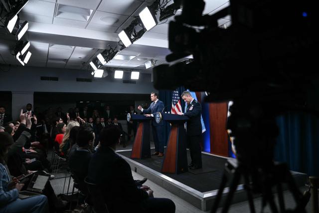 (L/R) US Defense Secretary Pete Hegseth and the Chairman of the Joint Chiefs of Staff General Dan Caine take questions during a press conference on US military action in Iran, at the Pentagon in Washington, DC, on March 2, 2026. The United States hit hundreds of targets across Iran, and Israel expanded its bombing to Lebanon on Monday as President Donald Trump vowed to avenge the first US deaths in the war he launched to topple Tehran's ruling clerics. Iranian forces fired missiles and drones across the Middle East, killing people in Israel and the United Arab Emirates, in retaliation for the conflict that began February 28 with the death of Iran's supreme leader, Ayatollah Ali Khamenei. (Photo by Brendan SMIALOWSKI / AFP)