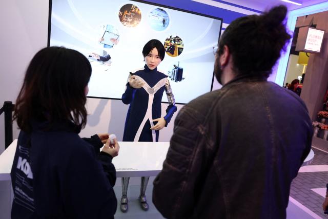 A picture taken on March 2, 2026 in Barcelona shows a Japanese company KDDI humanoid robot during the Mobile World Congress (MWC), the world's biggest mobile technology showcase and fair. The Mobile World Congress (MWC), the major annual telecommunications event, opens today in Barcelona for an edition where Artificial Intelligence in telecommunications will take center stage in the debates. The event, which marking its twentieth anniversary, will host the world's leading telecommunications operators and numerous manufacturers. 109,000 industry professionals and visitors are expected. (Photo by Josep LAGO / AFP)