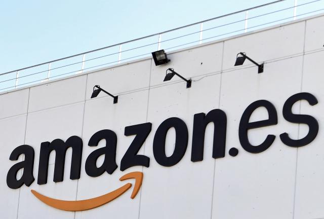 (FILES) Picture shows a logo of the US electronic commerce and cloud computing company Amazon at its facilities in San Fernando de Henares, the biggest in Spain, on November 23, 2018. Amazon on February 2, 2026 announced another 18 billion euros ($21 billion) of investment in data centre projects in Spain, more than doubling its spending there on the infrastructure crucial for artificial intelligence and cloud computing. (Photo by OSCAR DEL POZO / AFP)
