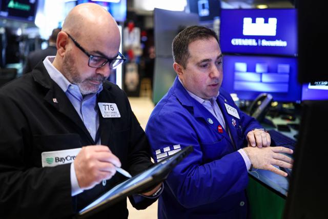 Traders work on the floor of the New York Stock Exchange (NYSE) at the opening bell on March 2, 2026, in New York City. Wall Street stocks fell early Monday as the war initiated by US-Israeli attacks on Iran expanded across the Middle East, lifting oil prices. (Photo by CHARLY TRIBALLEAU / AFP)