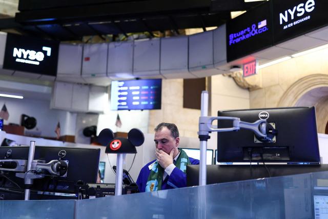 A trader works on the floor of the New York Stock Exchange (NYSE) at the opening bell on March 2, 2026, in New York City. Wall Street stocks fell early Monday as the war initiated by US-Israeli attacks on Iran expanded across the Middle East, lifting oil prices. (Photo by CHARLY TRIBALLEAU / AFP)