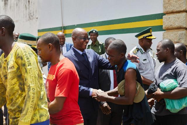 Zimbabwe Justice Minister Ziyambi Ziyambi bids farewell to inmates who qualified to be released on March 2 2026. Zimbabwe on Monday began releasing nearly 4,000 inmates who were granted presidential amnesty in a bid to ease overcrowding in prisons.
The cabinet announced the amnesty in February on the same day it approved sweeping changes to the constitution as part of a plan to extend 83-year-old President Emmerson Mnangagwa's term till 2030.
"The nation should note that the release of the 3,978 beneficiaries begins today," Justice Minister Ziyambi Ziyambi said at a press conference in the capital Harare.
Zimbabwe's prisons held just over 24,000 inmates in the second quarter of 2025, according to recent available national data. (Photo by Jekesai NJIKIZANA / AFP)