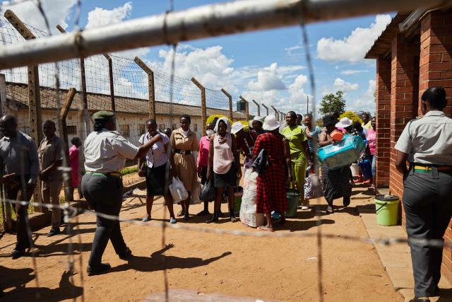 Women inmates who qualified to be releaased from prison during an amnesty granted by Zimbabwe President Emmerson Mnangagwa walk a step towards freedom at Chikurubi Womens Prison on March 2 2026. Zimbabwe on Monday began releasing nearly 4,000 inmates who were granted presidential amnesty in a bid to ease overcrowding in prisons.
The cabinet announced the amnesty in February on the same day it approved sweeping changes to the constitution as part of a plan to extend 83-year-old President Emmerson Mnangagwa's term till 2030.
"The nation should note that the release of the 3,978 beneficiaries begins today," Justice Minister Ziyambi Ziyambi said at a press conference in the capital Harare.
Zimbabwe's prisons held just over 24,000 inmates in the second quarter of 2025, according to recent available national data. (Photo by Jekesai NJIKIZANA / AFP)