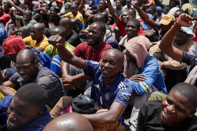 Inmates at Harare Central Prison salute Zimbabwe Justice Minister Ziyambi Ziyambi as he  bade them farewell moments before their release on March 2, 2026. Zimbabwe on Monday began releasing nearly 4,000 inmates who were granted presidential amnesty in a bid to ease overcrowding in prisons.
The cabinet announced the amnesty in February on the same day it approved sweeping changes to the constitution as part of a plan to extend 83-year-old President Emmerson Mnangagwa's term till 2030.
"The nation should note that the release of the 3,978 beneficiaries begins today," Justice Minister Ziyambi Ziyambi said at a press conference in the capital Harare.
Zimbabwe's prisons held just over 24,000 inmates in the second quarter of 2025, according to recent available national data. (Photo by Jekesai NJIKIZANA / AFP)