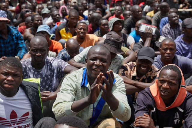 Inmates at Harare Central Prison salute Zimbabwe Justice Minister Ziyambi Ziyambi as he  bade them farewell moments before their release on March 2, 2026. Zimbabwe on Monday began releasing nearly 4,000 inmates who were granted presidential amnesty in a bid to ease overcrowding in prisons.
The cabinet announced the amnesty in February on the same day it approved sweeping changes to the constitution as part of a plan to extend 83-year-old President Emmerson Mnangagwa's term till 2030.
"The nation should note that the release of the 3,978 beneficiaries begins today," Justice Minister Ziyambi Ziyambi said at a press conference in the capital Harare.
Zimbabwe's prisons held just over 24,000 inmates in the second quarter of 2025, according to recent available national data. (Photo by Jekesai NJIKIZANA / AFP)