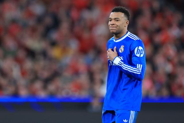 (FILES) Real Madrid's French forward #10 Kylian Mbappe reacts after missing a goal opportunity during the UEFA Champions League knockout round play-off first leg football match between SL Benfica and Real Madrid CF at Estadio da Luz in Lisbon on February 17, 2026. Kylian Mbappe, who has been suffering from a left knee injury since December 2025, is currently in Paris with Real Madrid's medical staff to "assess the progress" of his injury, but no "surgery" is planned "at this stage", AFP learned on March 2, 2026, from the French striker's entourage. (Photo by PATRICIA DE MELO MOREIRA / AFP)