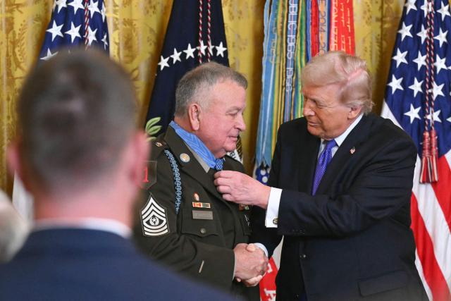 US President Donald Trump awards the Medal of Honor to retired Army Command Sgt. Major Terry P. Richardson during a ceremony in the East Room of the White House on March 2, 2026, in Washington, DC. President Trump awarded the Medal of Honor to retired Army Command Sgt. Major Terry P. Richardson, who served in the Vietnam War, posthumously to Army Master Sgt. Roderick W. Edmonds, who served in World War II, and posthumously to Staff Sgt. Michael Ollis, who died in combat in Afghanistan in 2013. (Photo by SAUL LOEB / AFP)