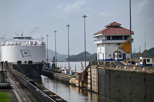 (FILES) A car carrier ship sails through the Pedro Miguel Locks during maintenance works at the Panama Canal, on the outskirts of Panama City on May 30, 2025. The Panama Canal said on March 2, 2026 that it is "monitoring" developments in maritime trade following the war unleashed in the Middle East by joint attacks by the United States and Israel against Iran. (Photo by MARTIN BERNETTI / AFP)
