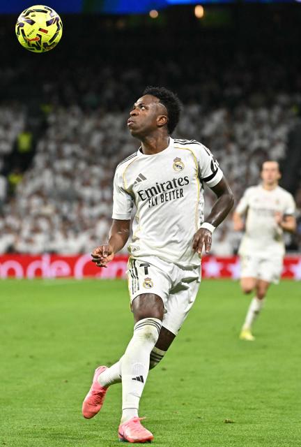 Real Madrid's Brazilian forward #07 Vinicius Junior stares at the ball during the Spanish league football match between Real Madrid CF and Getafe CF at Santiago Bernabeu Stadium in Madrid on March 2, 2026. (Photo by Javier SORIANO / AFP)