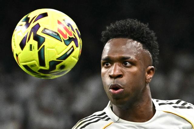 Real Madrid's Brazilian forward #07 Vinicius Junior stares at the ball during the Spanish league football match between Real Madrid CF and Getafe CF at Santiago Bernabeu Stadium in Madrid on March 2, 2026. (Photo by Javier SORIANO / AFP)