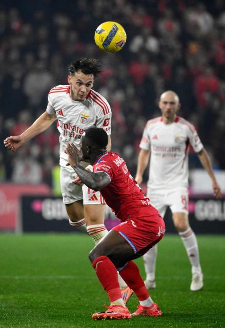 SL Benfica's Bosnian defender #17 Amar Dedic wins a header over Gil Vicente's Ivorian defender #03 Ghislain Konan during the Portuguese league football match between Gil Vicente FC and SL Benfica at Cidade de Barcelos stadium in Barcelos on March 2, 2026. (Photo by Miguel RIOPA / AFP)