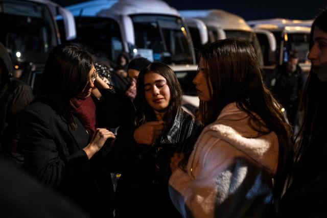 A woman mourns during a funeral of Yaakov Biton, 16, and his two sisters Avigail, 15, and Sarah, 13, who were killed the previous day in an Iranian attack, at a cemetery on the Mount of Olives in Jerusalem on March 2, 2026. The United States and Israel launched strikes against Iran on February 28, killing Iran's supreme leader and top military leaders, prompting authorities to retaliate with strikes on Israel and across the Gulf. (Photo by JOHN WESSELS / AFP)