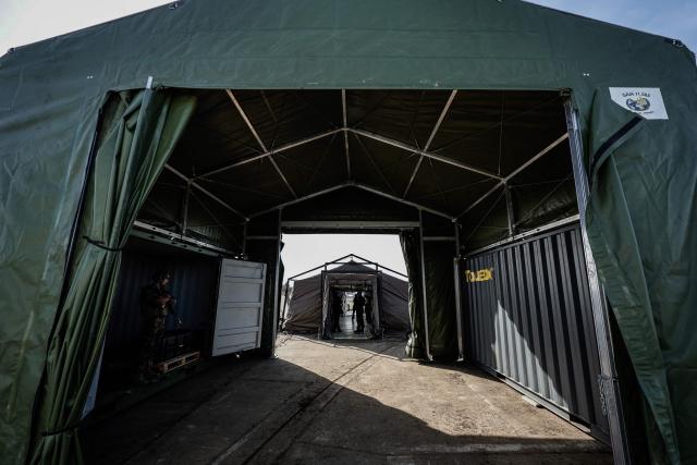 This photograph shows decontamination tents displayed during the drill named Orion in Crucey military base, next to Dreux, on February 26, 2026. (Photo by STEPHANE DE SAKUTIN / AFP)