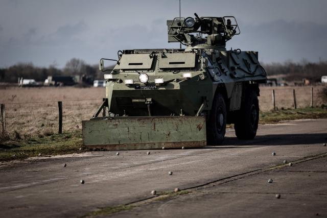 A French Armoured Forward Vehicle (VAB) clears a runway from land mines during the drill named Orion in Crucey military base, next to Dreux, on February 26, 2026. (Photo by STEPHANE DE SAKUTIN / AFP)