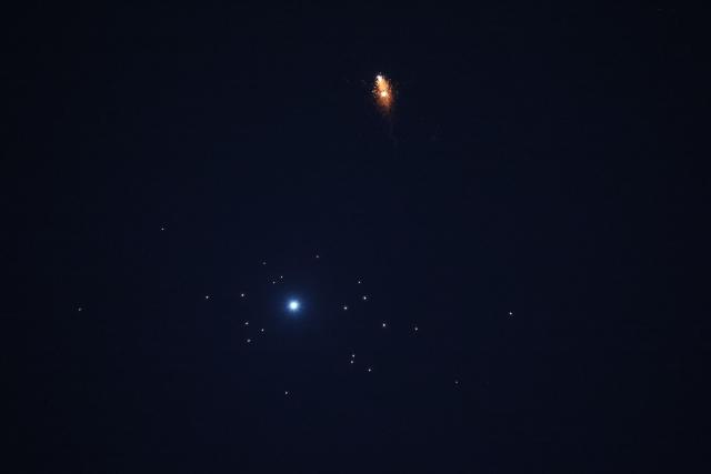 Rocket trails are seen in the sky amid a fresh barrage of Iranian missile attacks above the Israeli coastal city of Tel Aviv on March 3, 2026. (Photo by Jack GUEZ / AFP)