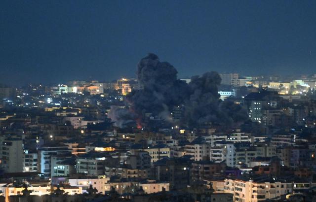 Fire blazes and black smoke rises from the site of an Israeli airstrike that targeted the office of the Hezbollah affiliated Al-Manar TV station in Beirut’s southern suburb of Haret Hreik on March 3, 2026. An Israeli strike hit the south Beirut office of Al-Manar TV, which is affiliated with Iran-backed militant group Hezbollah, the broadcaster said on March 3. Israel "targets the Al-Manar Channel building in the Haret Hreik area," Al-Manar wrote on Telegram, referring to a part of south Beirut. (Photo by FADEL itani / AFP)