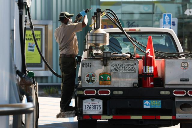 An inspector with the Los Angeles County Agricultural Commissioner tests a gasoline fuel pump at a gas station in Los Angeles, California on March 2, 2026. Energy prices surged on March 2 as the war in the Middle East led to outages of key energy production operations. In parallel, energy markets are also absorbing a de facto halt to traffic in the Strait of Hormuz, through which about 20 percent of global supply of oil and liquid natural gas travel.

The waterway has not technically been closed, but major maritime companies have suspended travel through it as insurance costs soar amid heightened risk. (Photo by Patrick T. Fallon / AFP)