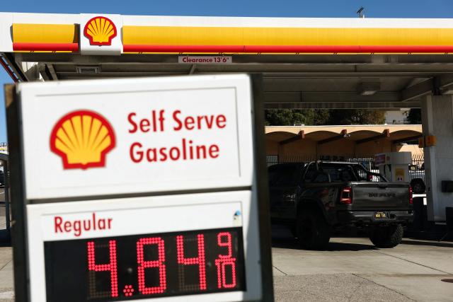 A sign with the current regular gas price is displayed at a gas station in Los Angeles, California on March 2, 2026. Energy prices surged on March 2 as the war in the Middle East led to outages of key energy production operations. In parallel, energy markets are also absorbing a de facto halt to traffic in the Strait of Hormuz, through which about 20 percent of global supply of oil and liquid natural gas travel.

The waterway has not technically been closed, but major maritime companies have suspended travel through it as insurance costs soar amid heightened risk. (Photo by Patrick T. Fallon / AFP)