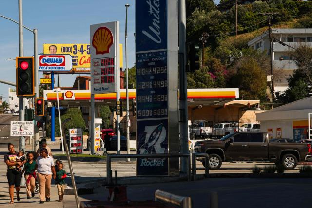 Signs with current gas prices are displayed at two gas stations in Los Angeles, California on March 2, 2026. Energy prices surged on March 2 as the war in the Middle East led to outages of key energy production operations. In parallel, energy markets are also absorbing a de facto halt to traffic in the Strait of Hormuz, through which about 20 percent of global supply of oil and liquid natural gas travel.

The waterway has not technically been closed, but major maritime companies have suspended travel through it as insurance costs soar amid heightened risk. (Photo by Patrick T. Fallon / AFP)