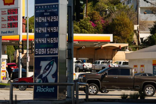 Signs with current gas prices are displayed at two gas stations in Los Angeles, California on March 2, 2026. Energy prices surged on March 2 as the war in the Middle East led to outages of key energy production operations. In parallel, energy markets are also absorbing a de facto halt to traffic in the Strait of Hormuz, through which about 20 percent of global supply of oil and liquid natural gas travel.

The waterway has not technically been closed, but major maritime companies have suspended travel through it as insurance costs soar amid heightened risk. (Photo by Patrick T. Fallon / AFP)