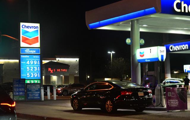 A sign with current gas prices is displayed at a gas station in Los Angeles, California on March 2, 2026. Energy prices surged on March 2 as the war in the Middle East led to outages of key energy production operations. In parallel, energy markets are also absorbing a de facto halt to traffic in the Strait of Hormuz, through which about 20 percent of global supply of oil and liquid natural gas travel.

The waterway has not technically been closed, but major maritime companies have suspended travel through it as insurance costs soar amid heightened risk. (Photo by Frederic J. BROWN / AFP)